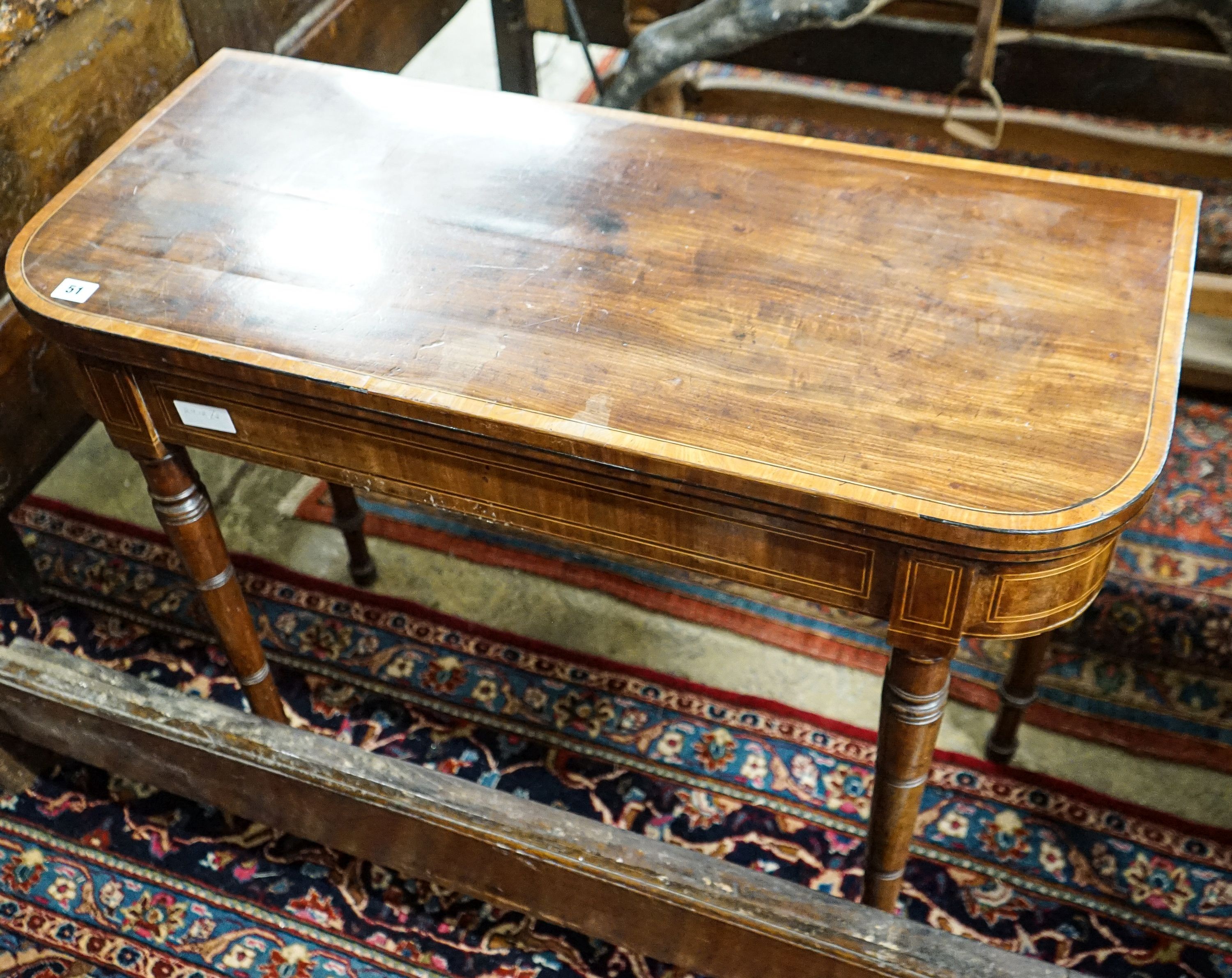 A Regency banded satinwood mahogany folding card table, width 91cm, depth 40cm, height 76cm